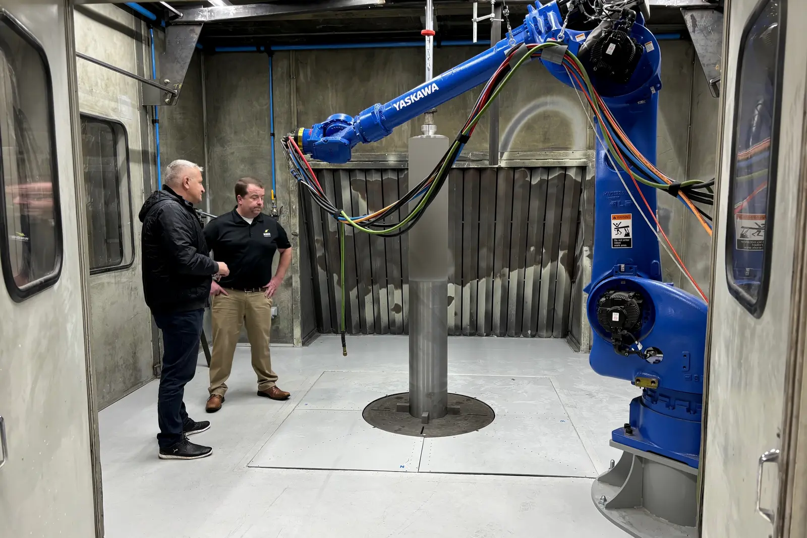 A robotic HVOF thermal spray booth